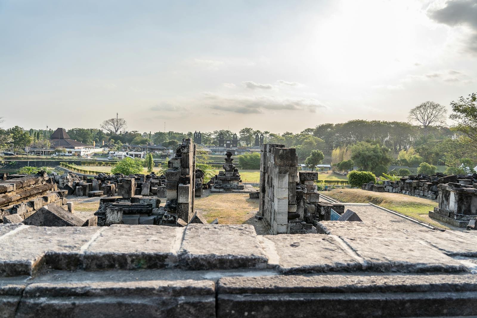 Explore ancient stone ruins outdoor under sunset skies in Southeast Asia. Perfect for history and travel enthusiasts.